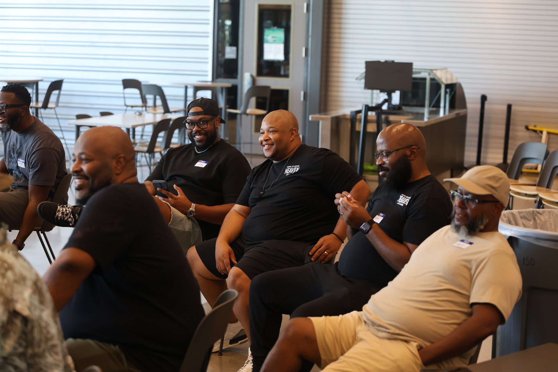 Men laughing and enjoying fellowship at a gathering
