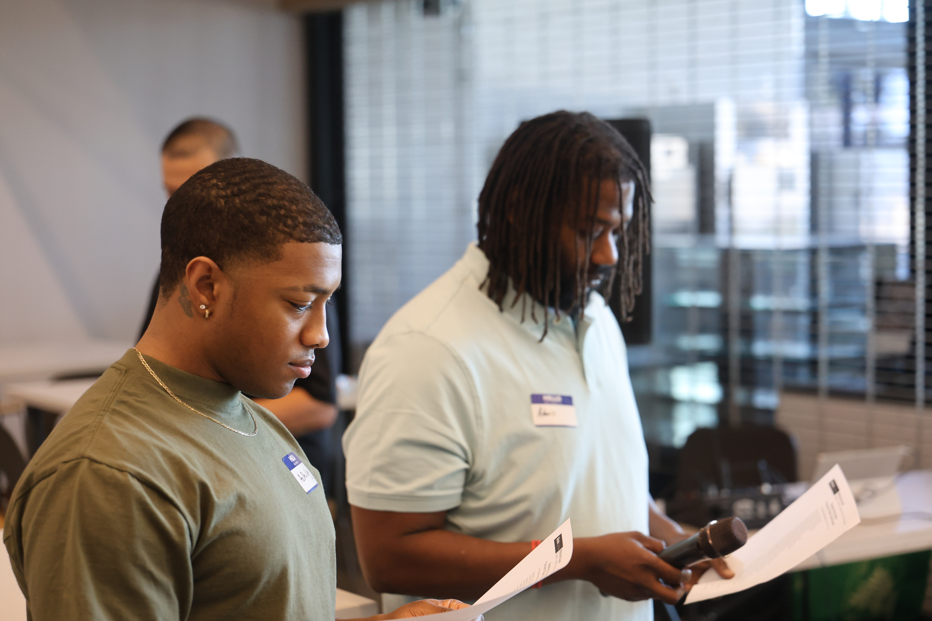Two men reading during a men's gathering