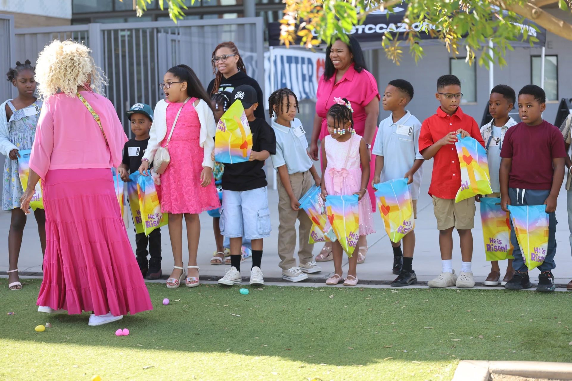 Kids gathered with He Is Risen goodie bags